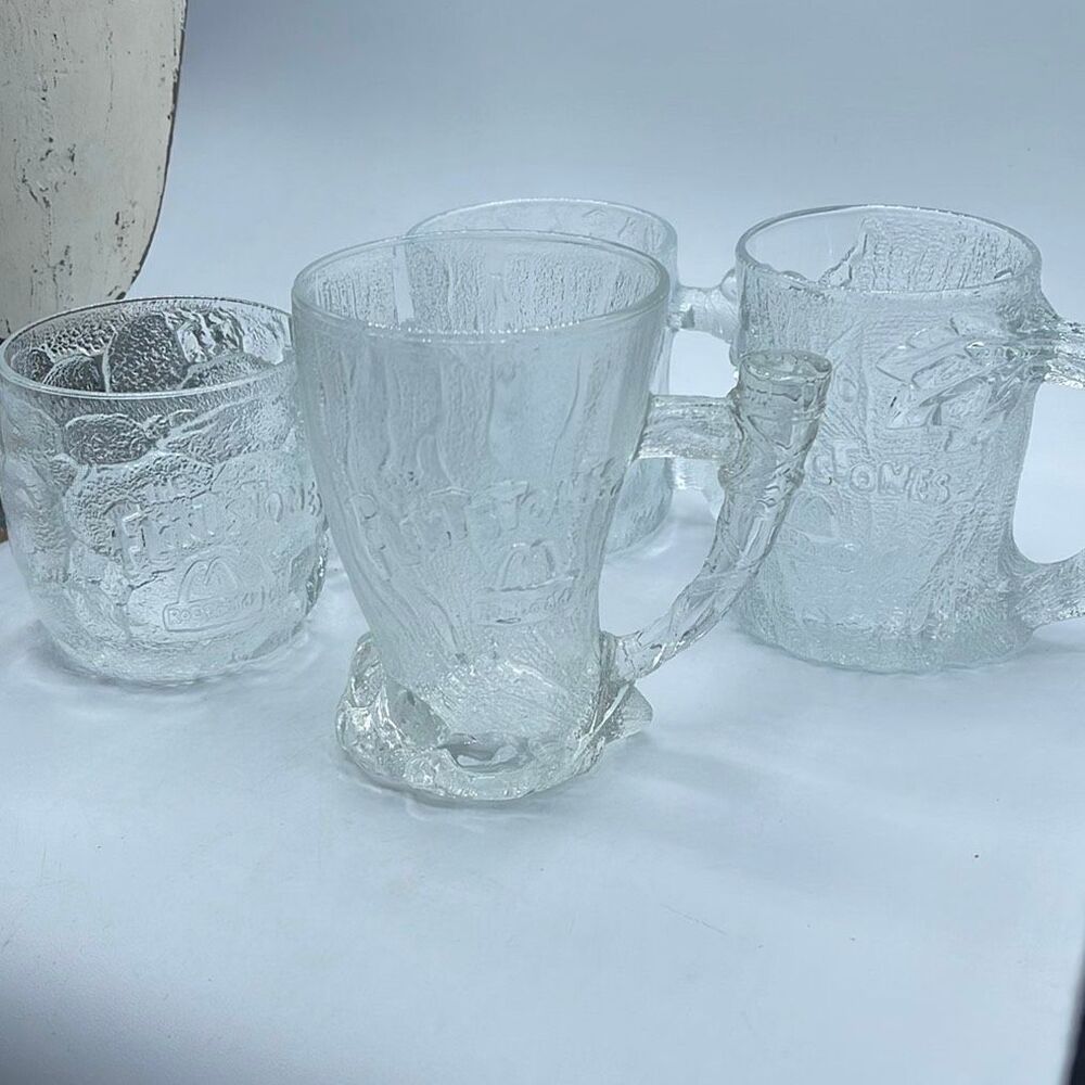 1993 set of 4 The Flintstones glass mugs from McDonalds ( RocDonalds ) .